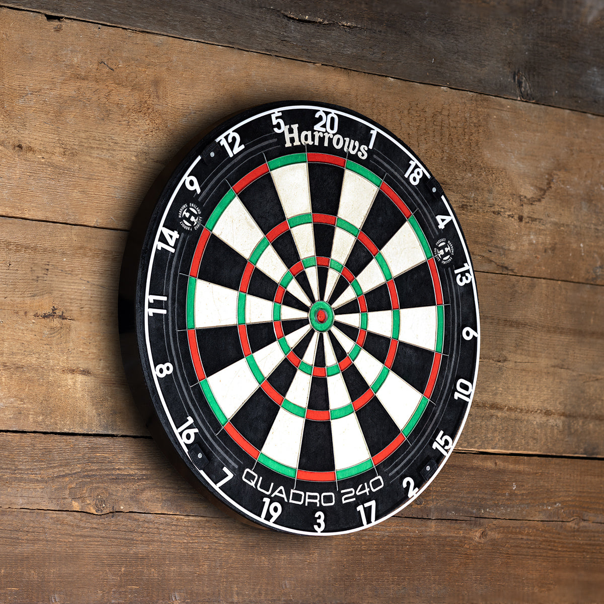 Harrows Quadro 240 Dartboard lifestyle image showing the dartboard installed and ready for play in a real world setting