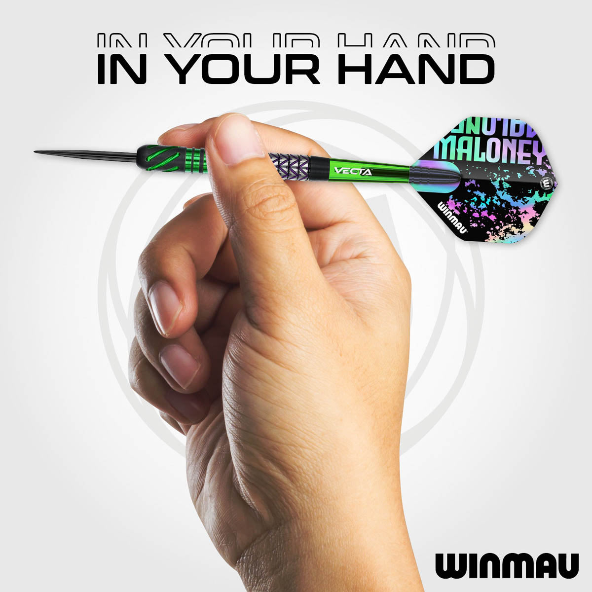 Mike Maloney Steel Tip Darts in hand image showing the barrel held in a player's hand to demonstrate grip position, scale, and profile shape