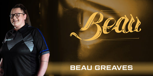 Beau Greaves wearing her branded shirt with 'Beau' logo and 'Beau Greaves' text on a dark background, featuring a zoomed side-angle of her face.