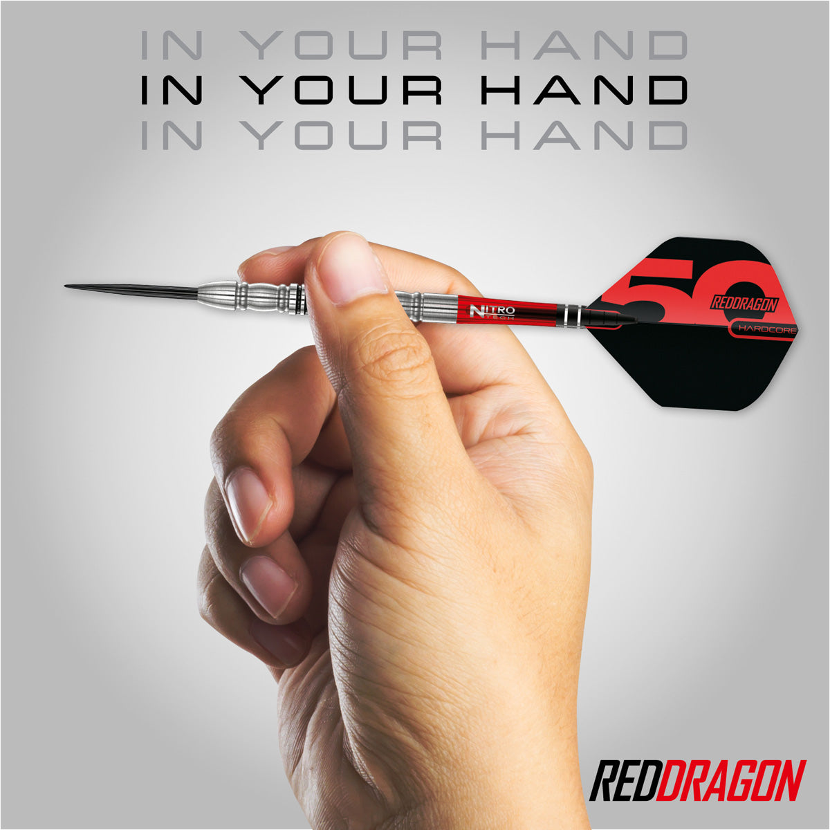 Red Dragon Penetrator 4 Steel Tip Darts in hand image showing the barrel size, grip profile, and scale when held