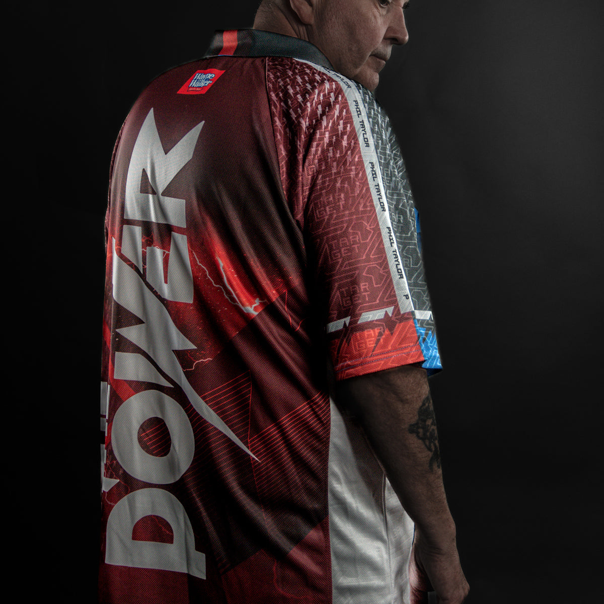 Target Phil Taylor 2025 Playing Shirt action image showing Phil Taylor wearing the shirt during competition or match play.